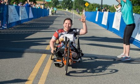 Sen. Duckworth, who supports unlimited abortions for women, participates in a race using an adapted bike.