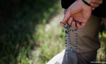 prayer, spain, violence against man praying rosary at Planned Parenthood