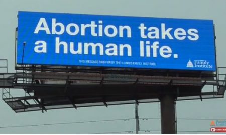 screenshot from video, billboard, abortion