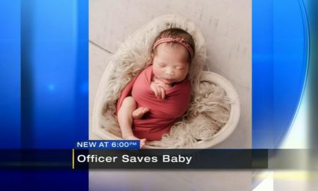 screenshot, officer saves baby