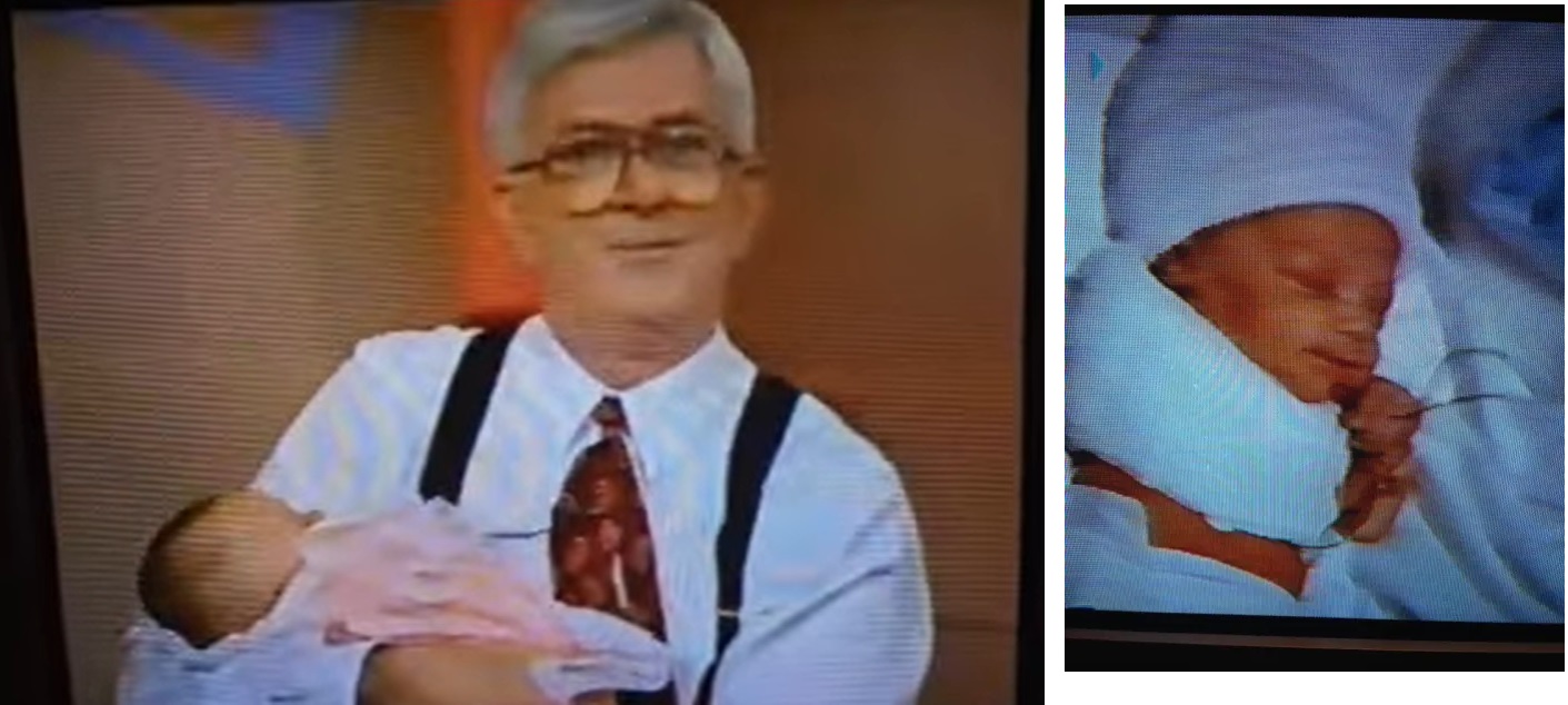 Phil Donahue holds little Ana Rosa Rodriguez whose arm was severed in late abortion